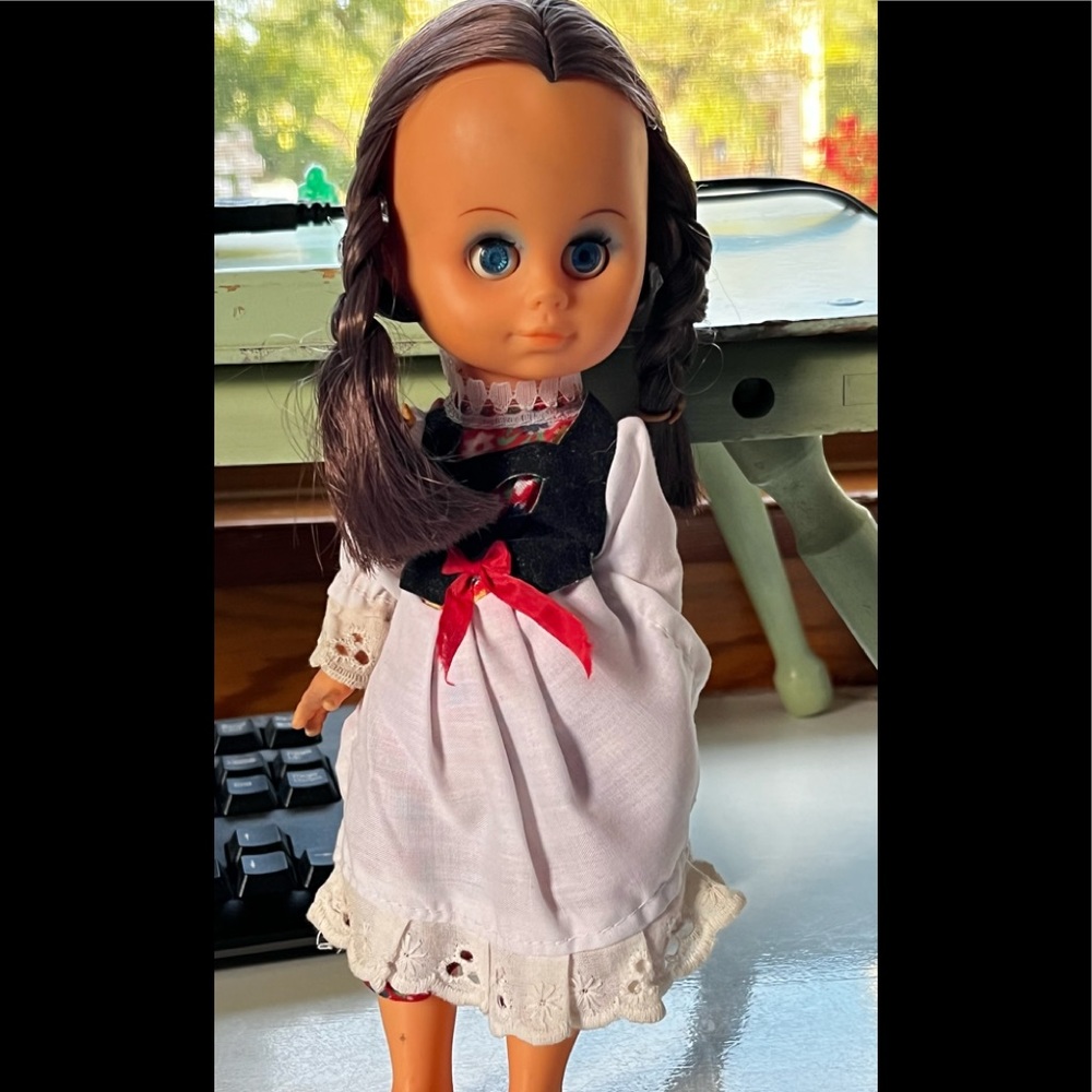 Vintage sleep eyes doll with braids. 10” tall in bohemian dress.